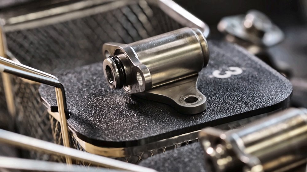 Fuel nozzle in cleaning basket